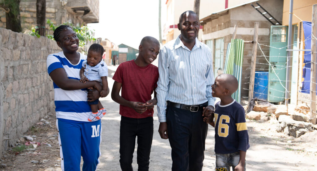 Family of five walking down street